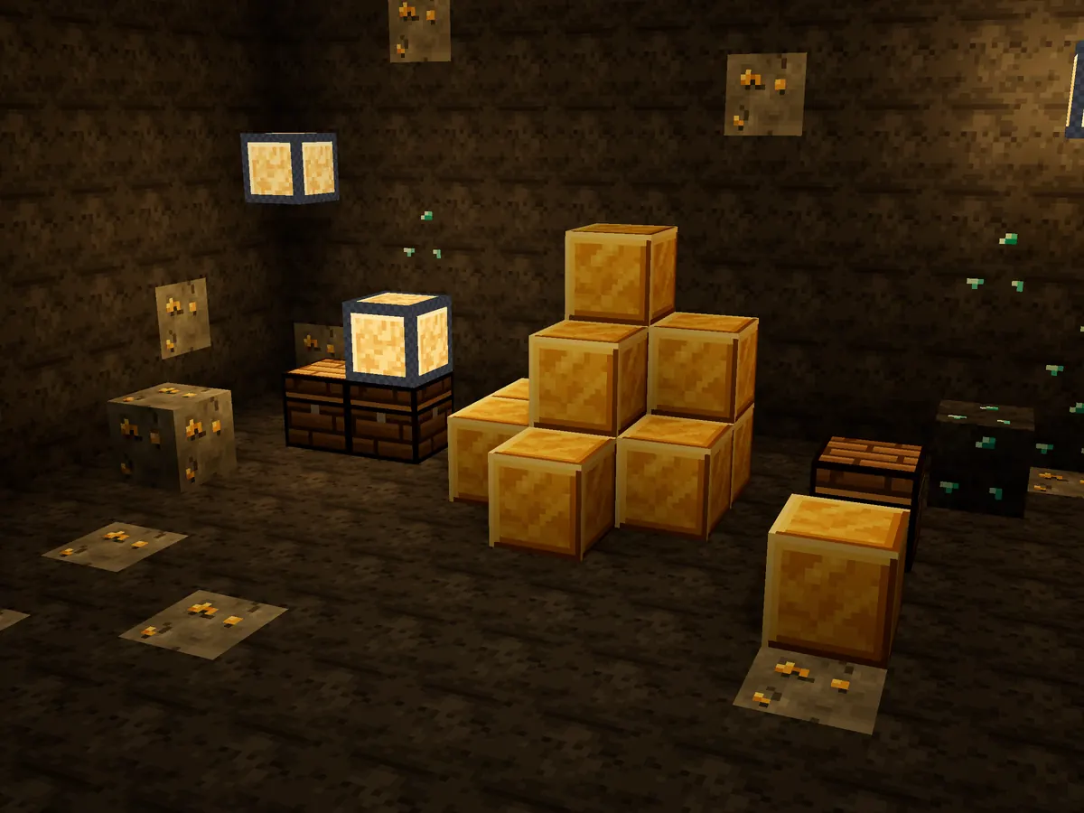 Blocs d'or, coffres et lanternes dans une grotte